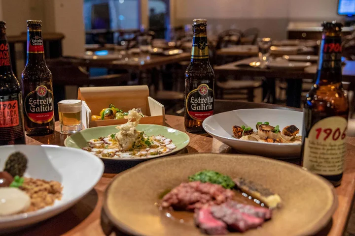 Beers and dishes in table