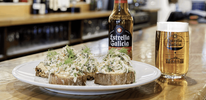 Crab, apple and fennel tostada dish with Estrella Galicia beer