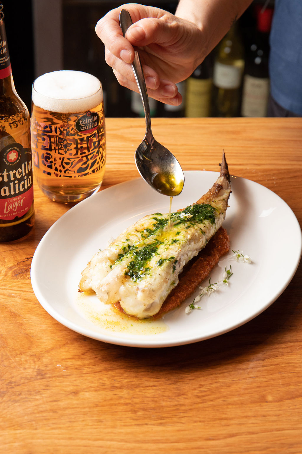 Grilled monkfish, Romesco sauce & wild garlic butter by Nieves Barragan served with Estrella Galicia